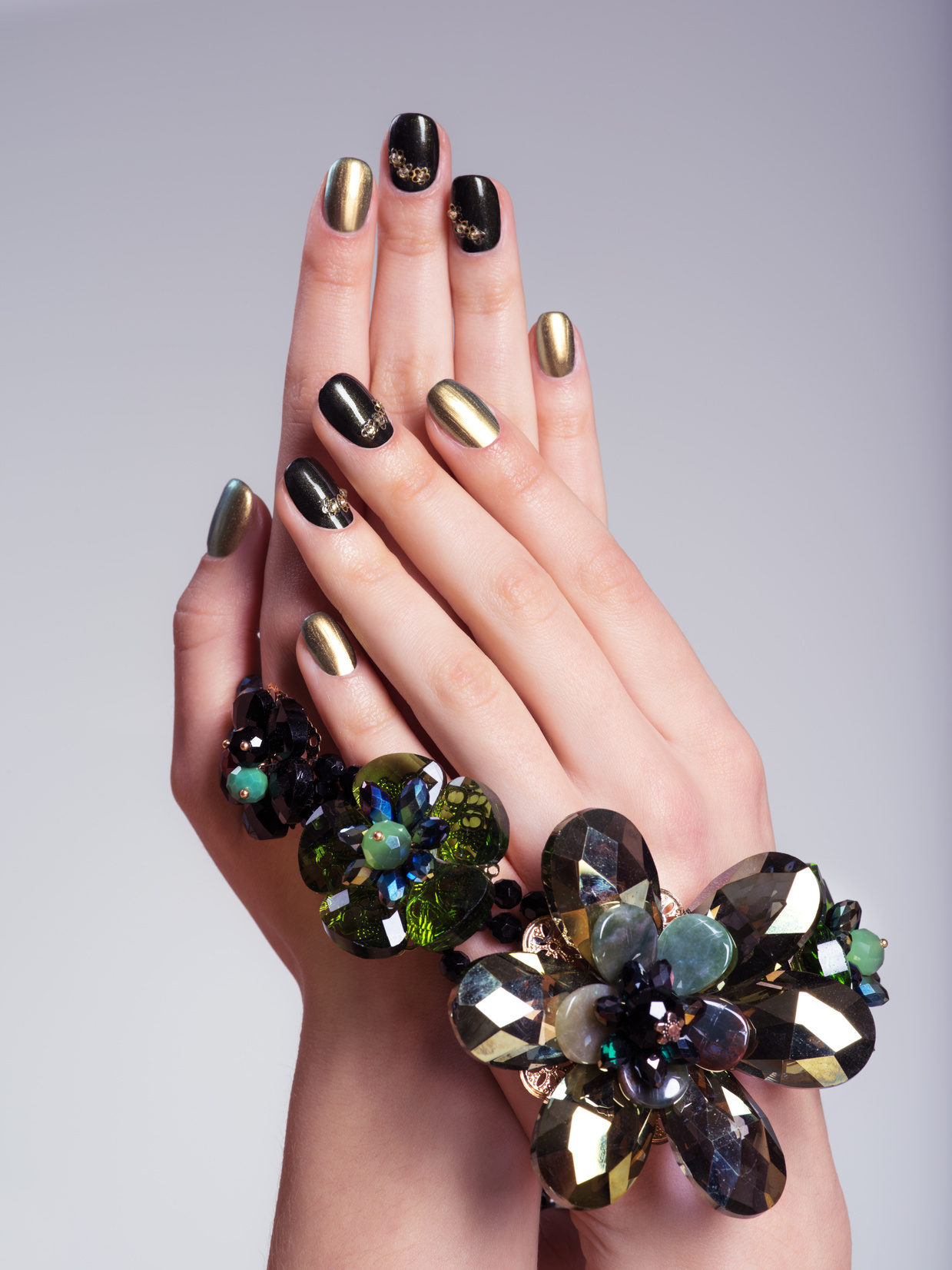 Beautiful Woman's Nails with  Creative Manicure and Jewelry