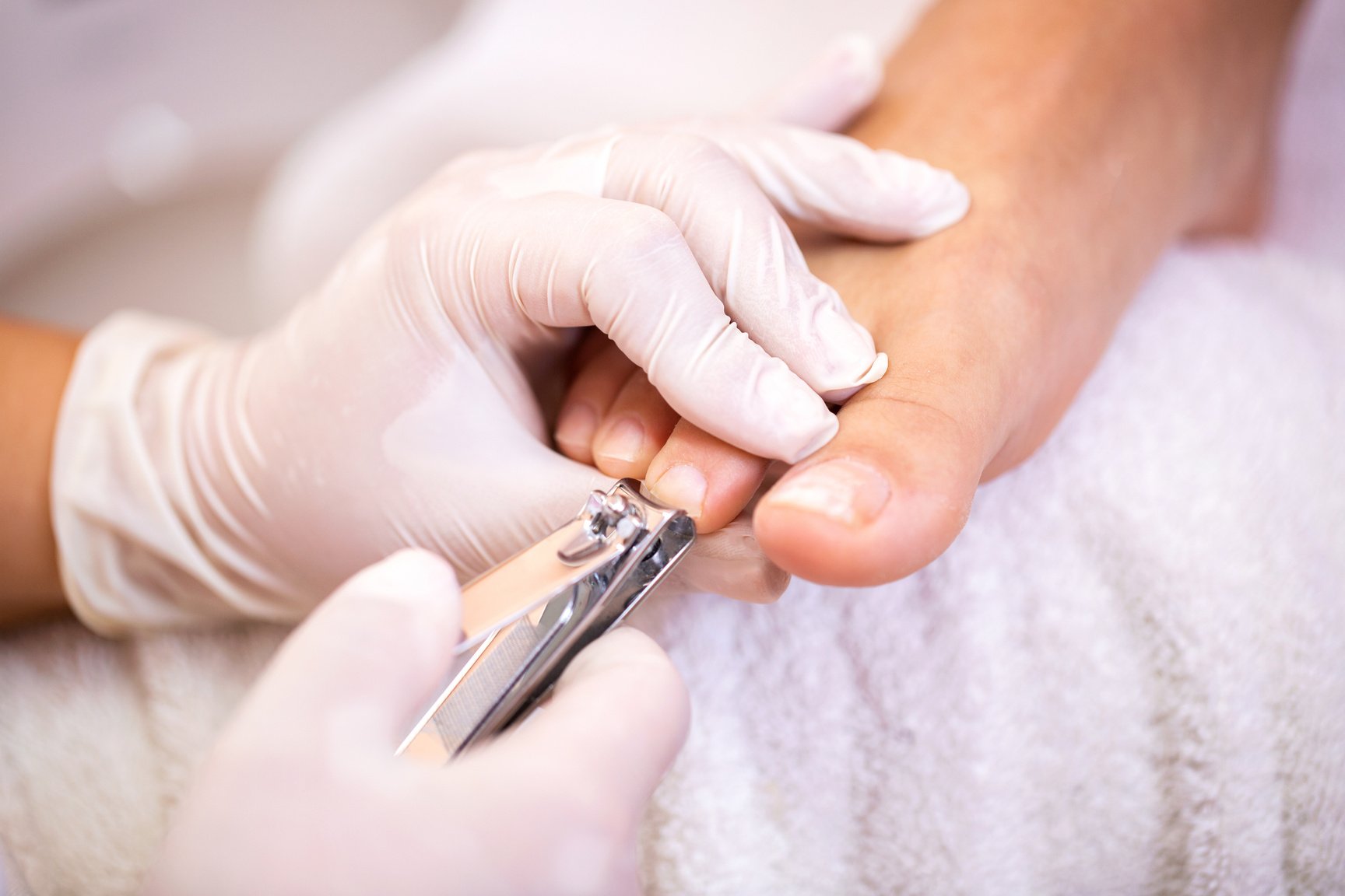 Toenail trimming action, pedicure concept